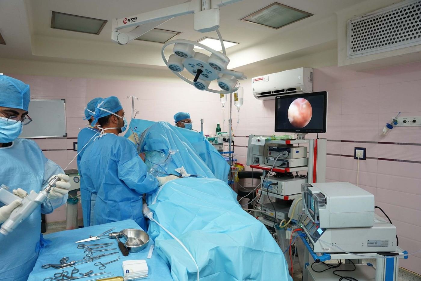 Surgical team performing laparoscopic surgery